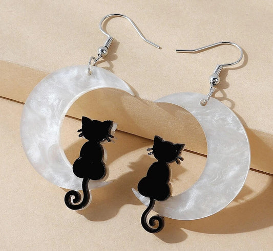 black cat on a crescent moon acrylic earrings for halloween